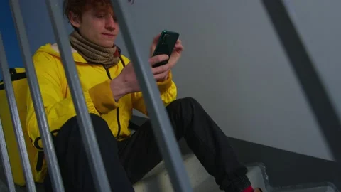 A courier with a phone in his hands Stock Footage 236897348