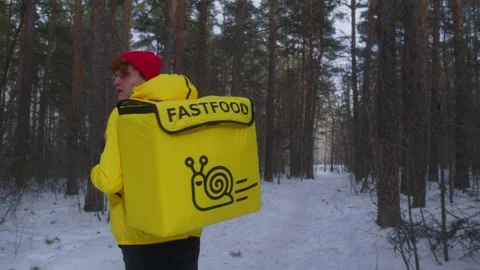 The courier is running in the woods Stock Footage 236898413