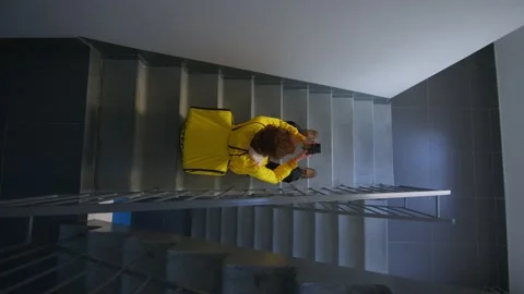 The courier is sitting on the stairs Stock Footage 236898117