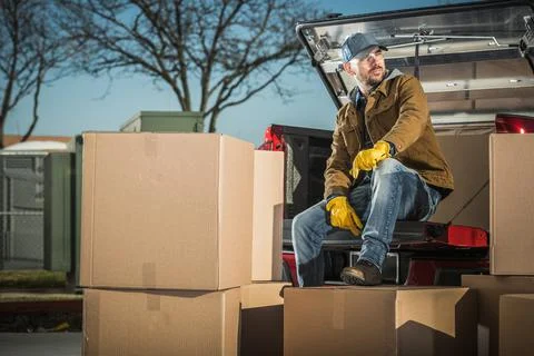 Courier Unloading Shipping Boxes Parcel From His Truck Photos