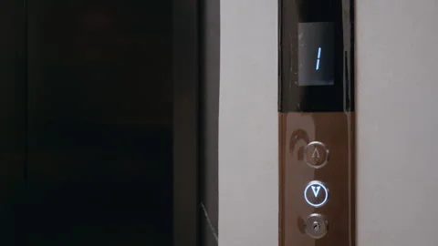 Courier Waiting for the Elevator to Arrive Video stock 322512422