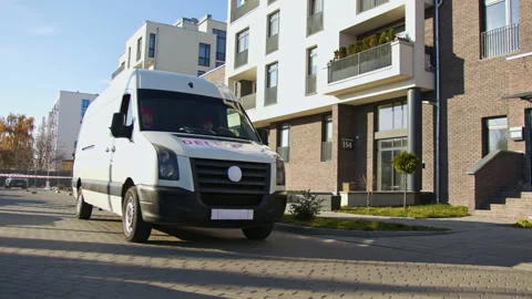 Couriers delivering parcel boxes to recipient on a van. Caucasian delivery men Stock Footage 166351691