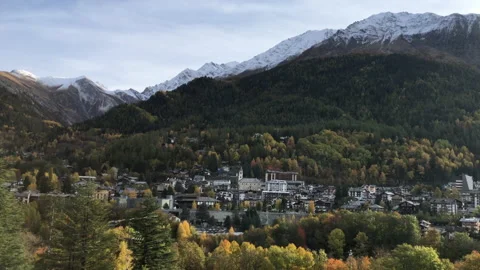 Courmayeur town during autumn viewed from opposite town. Valle dAosta, Italy Stock Footage