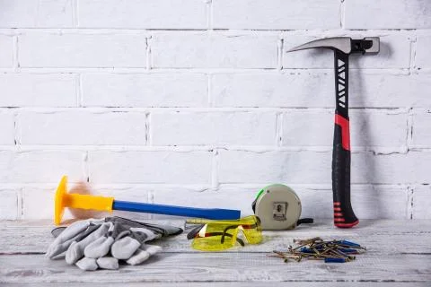Of course, the basic tool of any builder is a hammer. Stock Photos