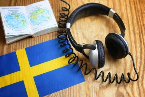 Course language headphone and flag on a table Stock Photos