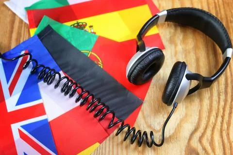 Course language headphone and flag on a table Stock Photos