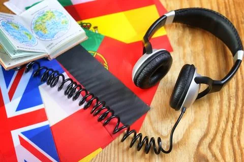 Course language headphone and flag on a table Stock Photos