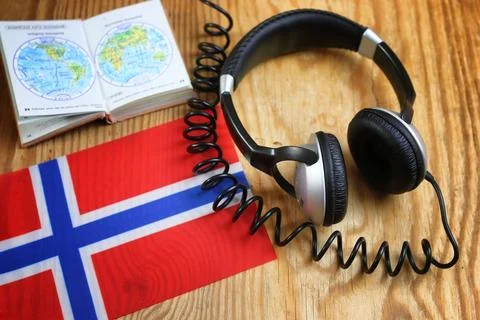 Course language headphone and flag on a table Stock Photos