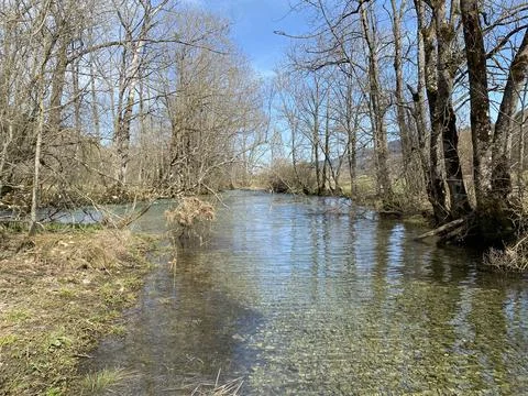 Course of the river Orbe between the cave or spring and settlement of Vallorbe Stock Photos