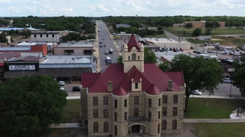 Courthouse Blocking a Highway Through a Small Town, Brady, Texas, USA Stock Footage 140623434