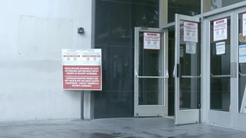 Courthouse Entrance with Security and Weapon Warning Signs Stock Footage 343959958