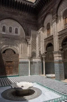 Courtyard of Al-Attarine Madrasa is a madrasa in Fez medina in Morocco, near  Stock Photos