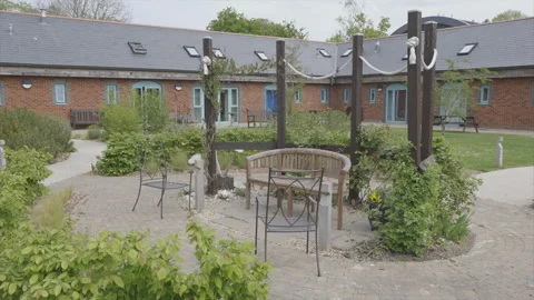 A courtyard with a bench and a table Stock Footage 301625961