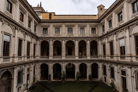 The courtyard of a building is empty and has a lot of windows Stock Photos