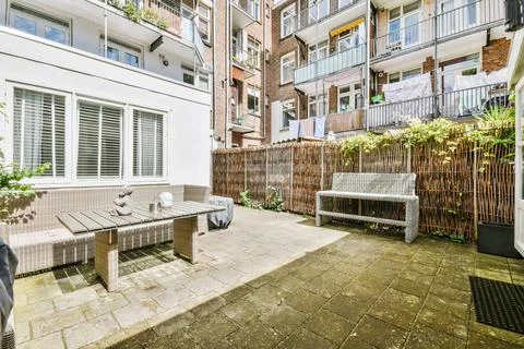 Courtyard with cozy sofa Stock Photos