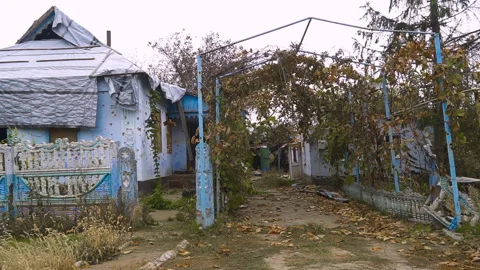 Courtyard in front of the house was destroyed by shelling Stock Footage 255124934