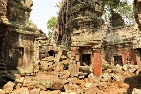 A courtyard inside the Ta Prohm Temple, filled with many big bricks, stones.. Stock Photos