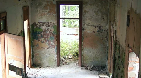 Courtyard of an old building, large Windows, on a background of green plants Stock-Footage 57325201