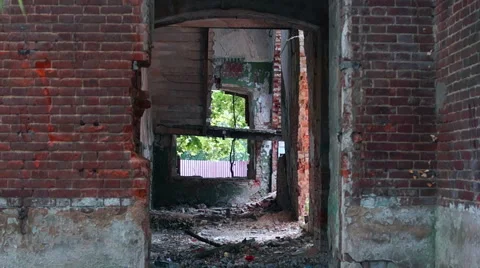 Courtyard of an old building, large Windows, on a background of green plants Stock-Footage 57325254