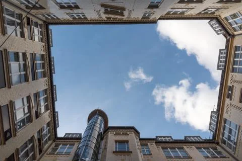 Courtyard of an old house with a cloud Foto stock
