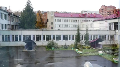 In the courtyard of the school building, the time-out is dark Stock Footage 81050438