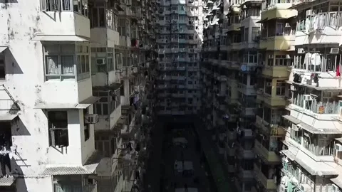Courtyard Surrounded by Multiple Story High-Rise Apartments in Hong Kong Stock Footage 235811244