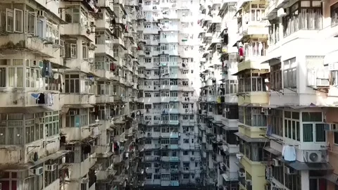 Courtyard Surrounded by Multiple Story High-Rise Apartments in Hong Kong Stock Footage 235815649