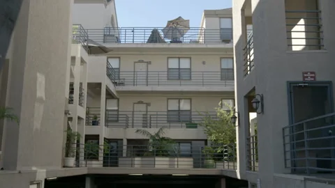 Courtyard View of Multi-Story Apartment Complex Stock Footage 343967580