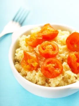 Couscous with cherry tomatoes Stock Photos