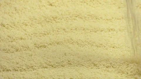 Couscous grits falling from top in slow motion 96 fps Stock Footage 112029758