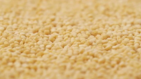 Couscous groats, side view. Raw groats - background. Stock Footage 144925911