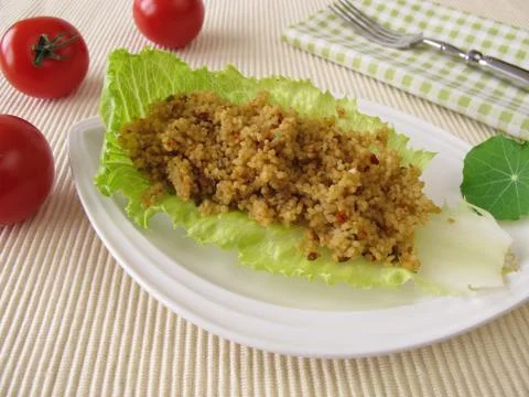 Couscous on a lettuce leaf Stock Photos