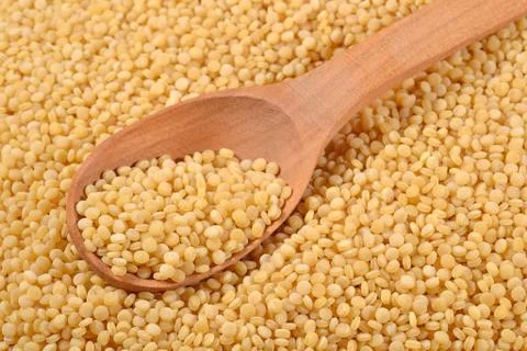 Couscous in a spoon Stock Photos