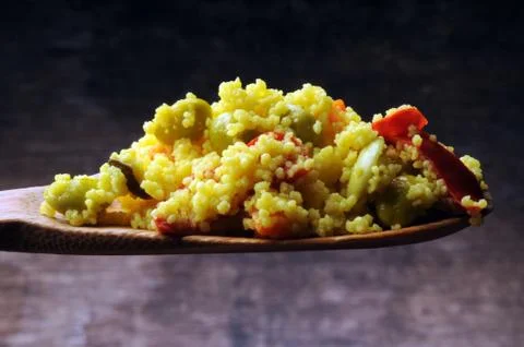 Couscous with vegetables on the spoon Stock Photos