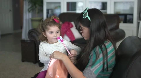 Cousins eating candy together Stock Footage 44477815