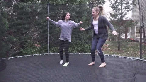 Cousins on the Trampoline Stock Footage 70065079
