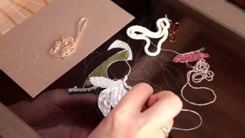 Couture embroidery using Luneville hook (crochet). Chain stitch Stock Footage 146258978