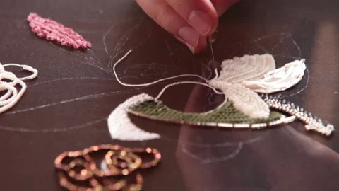 Couture embroidery using Luneville hook (crochet). Chain stitch Stock Footage 146259087