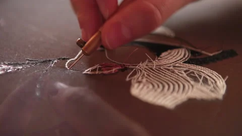 Couture embroidery using Luneville hook (crochet). Chain stitch Stock Footage 146259839