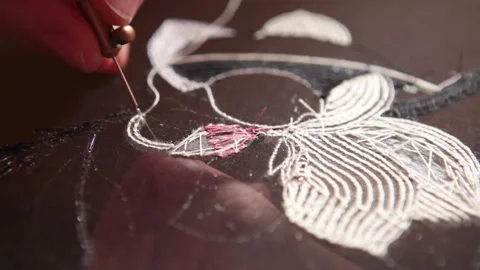 Couture embroidery using Luneville hook (crochet). Chain stitch Stock Footage 146259888