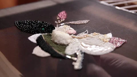 Couture embroidery using Luneville hook (crochet). Chain stitch Stock Footage 146260053