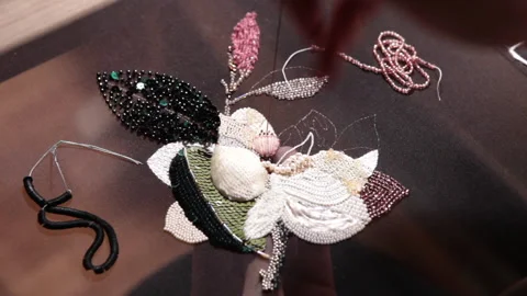Couture embroidery using Luneville hook (crochet). Chain stitch Stock Footage 146260074