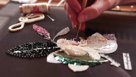 Couture embroidery using Luneville hook (crochet). Chain stitch Stock Footage 146260155