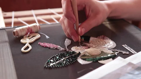 Couture embroidery using Luneville hook (crochet). Chain stitch Stock Footage 146260159