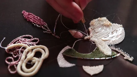 Couture embroidery using Luneville hook (crochet). Chain stitch Stock Footage 146260192