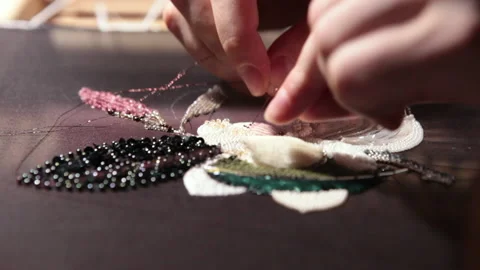 Couture embroidery using Luneville hook (crochet). Chain stitch Stock Footage 146260784
