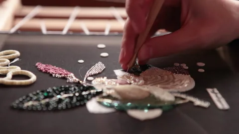 Couture embroidery using Luneville hook (crochet). Chain stitch Stock Footage 146261275