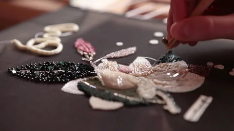Couture embroidery using Luneville hook (crochet). Chain stitch Stock Footage 146261403