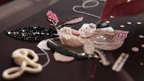Couture embroidery using Luneville hook (crochet). Chain stitch Stock Footage 146261689