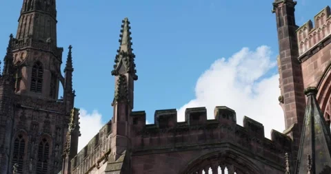 Coventry medieval cathedral over blue sky on sunny day Stock Footage 220597846